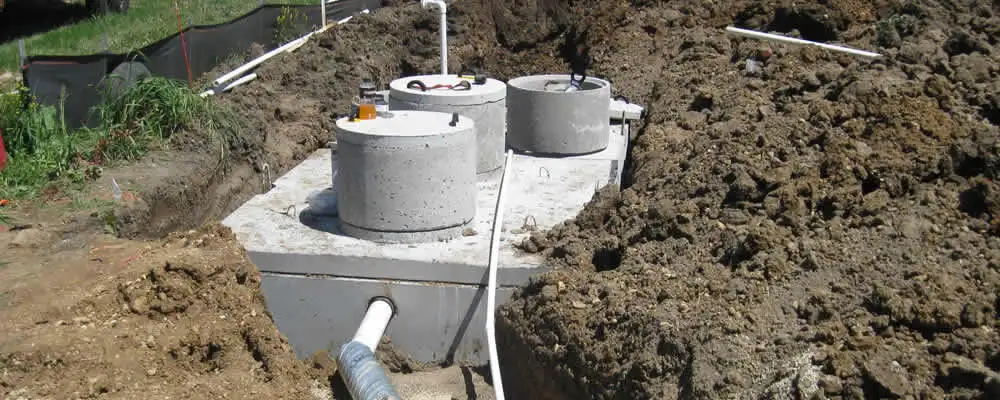 Septic system repair and installation site with tank access ports in Brandon, FL